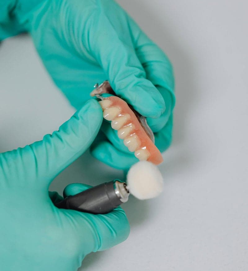 A denture being polished