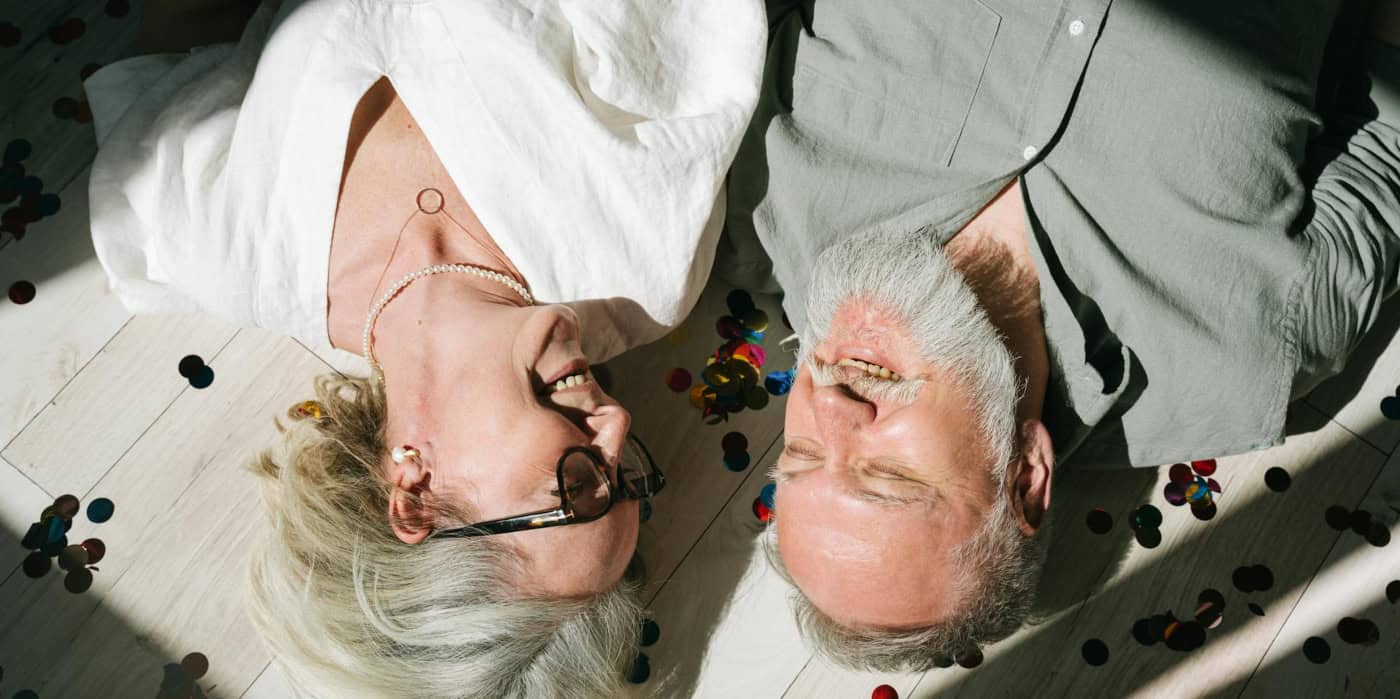 A mature couple smiling together